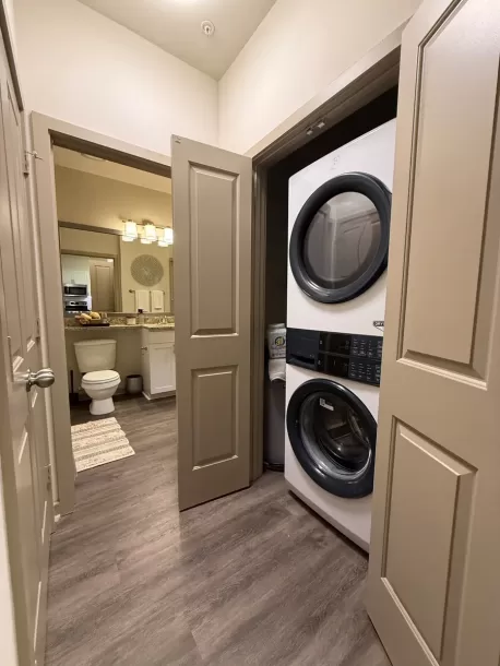 laundry machines adjacent to bathroom